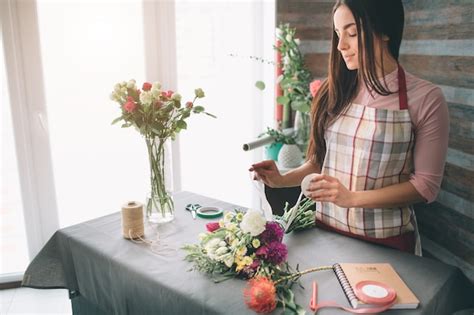 Premium Photo Female Florist At Work Pretty Young Dark Haired Woman