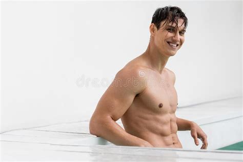 Joyful And Muscular Man Posing With Stock Photo Image Of Bodycare