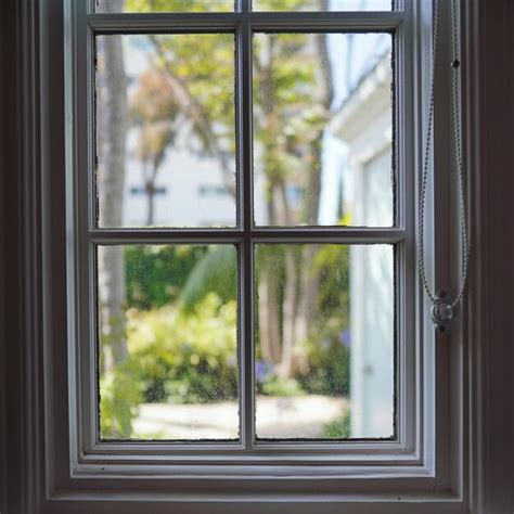 Premium Photo Trees Seen Through Window Of House