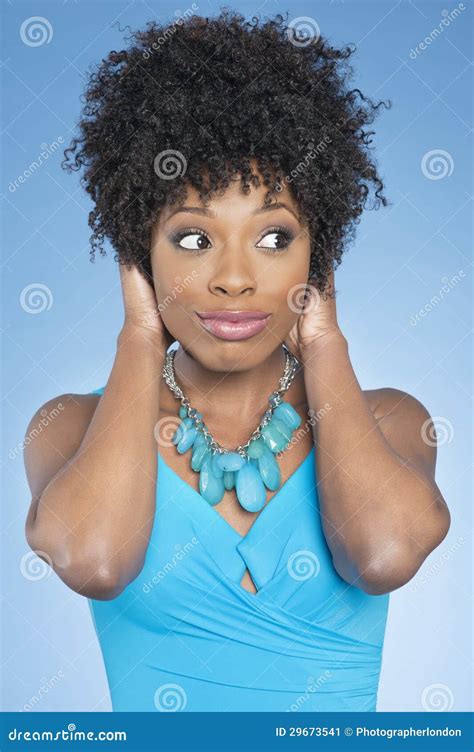 Happy African American Woman Covering Ears Over While Looking Away