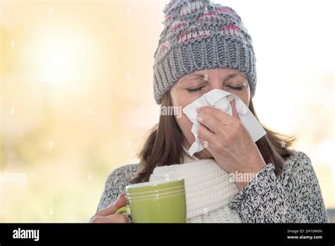 Mature Woman Blowing Her Nose Light Effect Stock Photo Alamy