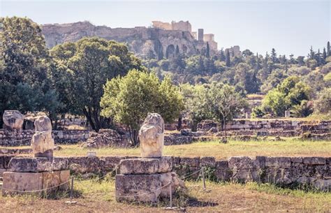 Premium Photo | Ruins of the agora overlooking acropolis athens