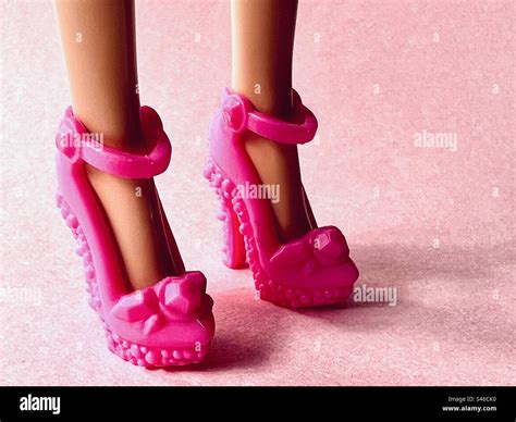 Barbie Doll Legs With Hot Pink High Heels Stock Photo Alamy