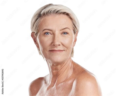 Portrait Of A Beautiful Mature Caucasian Woman Posing Topless Against