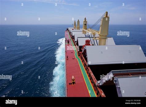 Bulk carrier proceeding loading port with open holds Stock Photo - Alamy