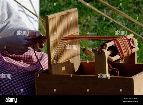 Weaving On A Small Hand Loom At A Colonial Life Demonstration On