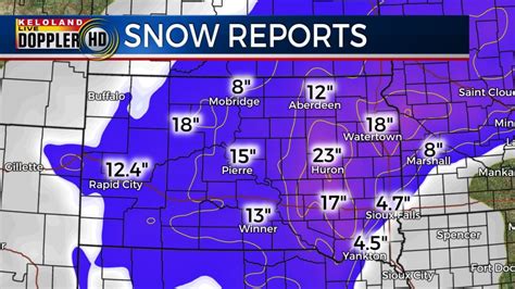 The Latest: Snowfall totals