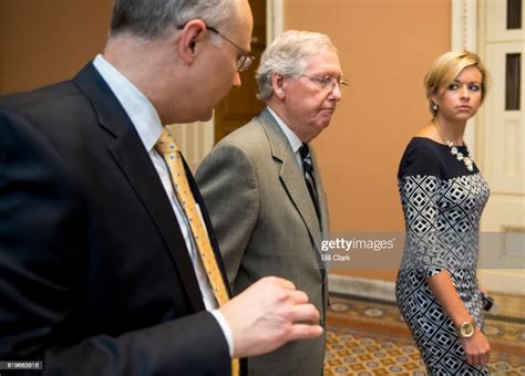 Senate Majority Leader Mitch McConnell, R-Ky., speaks with staff as ...