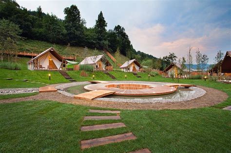 An Outdoor Area With Steps Leading Up To It And Several Cabins In The