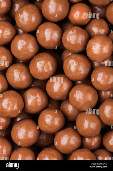 Round Crunchy Milk Chocolate Candies To Use As Background Macro Stock