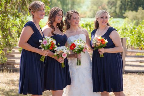 Bridesmaids And Bride Holding Colorful Bouquet