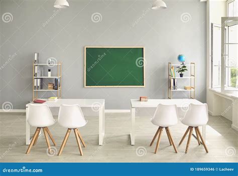 Empty School Classroom Interior With Desks And Chairs Space For Text