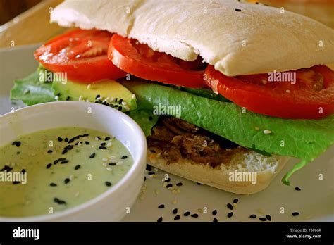 Savory Beef And Fresh Vegetable Sandwich With Green Mustard Sauce Stock