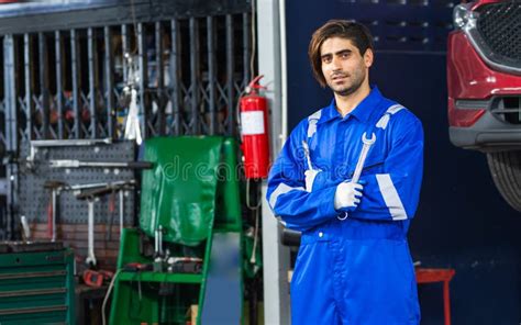 Portrait Adult Handsome Male Mechanic Wearing Uniform Crossed Arms