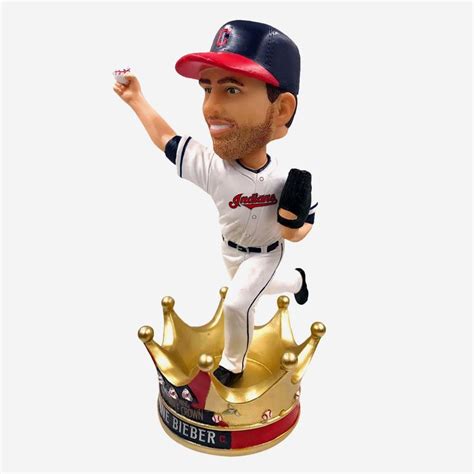 A Bobble Head Figurine With A Baseball Player Holding A Bat And Wearing