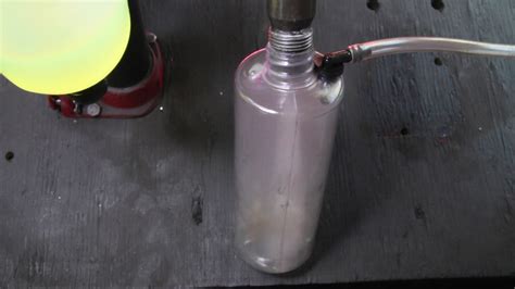 Fuel Injector Testing Fuel Spray And Fume Containment Bottle In Action