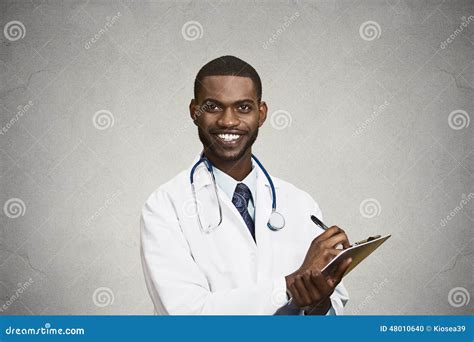 Male Health Care Professional Doctor Taking Patient Notes Stock Photo