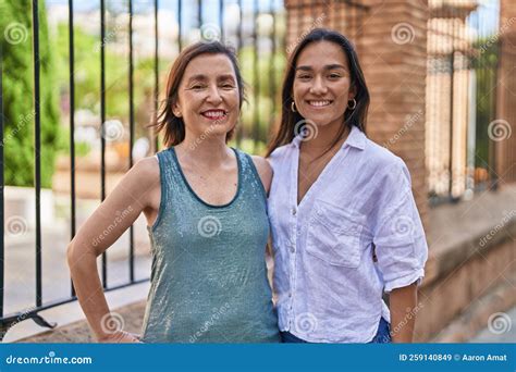 Two Women Mother And Daughter Smiling Confident Standing Together At