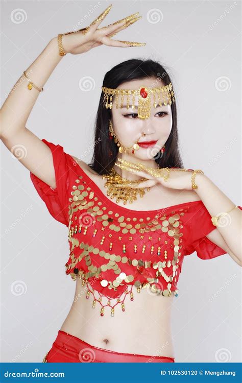 Graceful Asian Chinese Belly Dancer In White Background Stock Photo