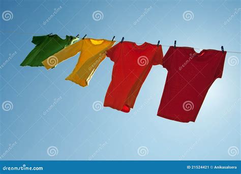 Colorful Clothes Hanging To Dry In The Blue Sky Stock Image Image Of