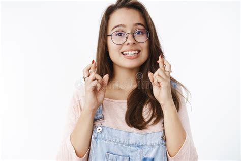 Girl Crossing Fingers With Hopeful Optimistic Smile Having Faith Dream