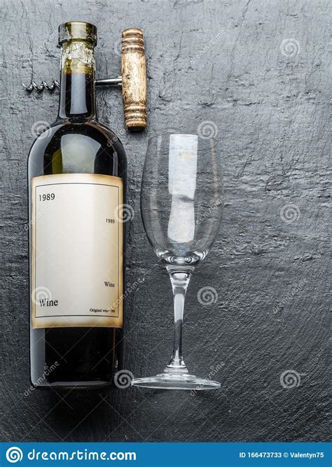 Wine Bottle Wine Glass And Corkscrew On The Graphite Board Stock Image