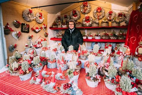 Helsinki, Finland. Woman Selling Christmas Souvenirs Gifts in Form of Wicker Baskets and Wreaths ...