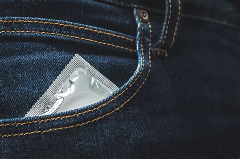 Premium Photo World Aids Day Men Hold Condoms Before Having Sex