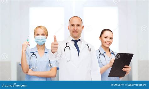 Group Of Doctors At Hospital Showing Thumbs Up Stock Image Image Of