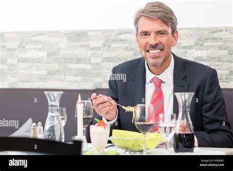 Man Eating Noodles Stock Photo Alamy