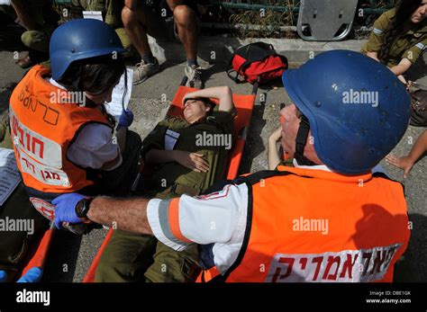 Wounded people being treated by first aid crew Stock Photo - Alamy