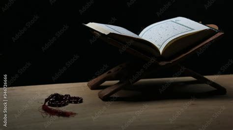 Quran In The Mosque Open For Prayers The Black Background Of The