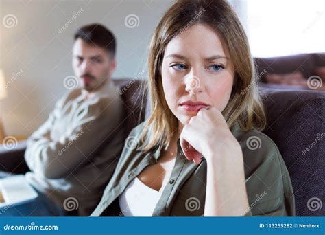 Angry Husband Shouting At Frustrated Wife Couple Arguing At Hom