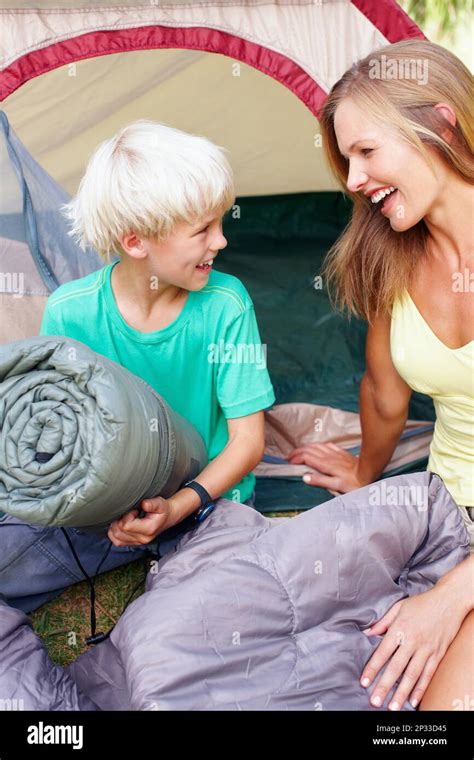 Mother And Son Enjoying Mother And Son Sitting In Front Of Tent And