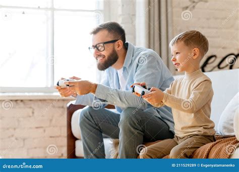 Father And Son Playing Videogame Together Stock Image Image Of