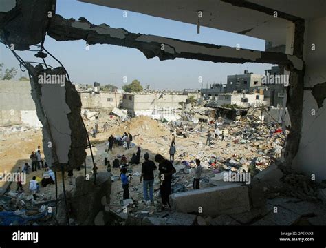 Palestinians Salvage Belongings In The Rubble Of Destroyed Buildings