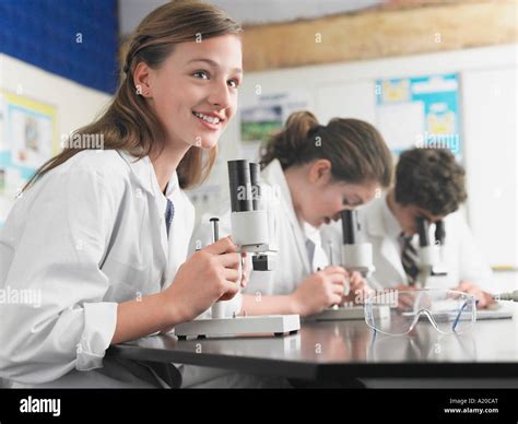 High School Students Using Microscopes In Classroom Stock Photo Alamy