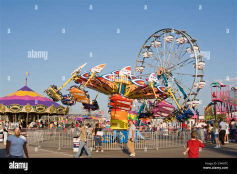 Carnival Rides And People Stock Photo - Alamy