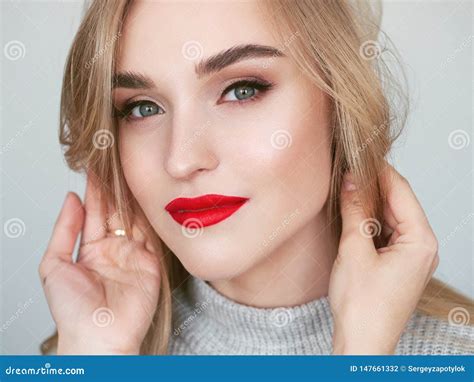 Closeup Natural Light Beauty Portrait Of Blonde Woman Model With Vibrant Saturated Red Lips
