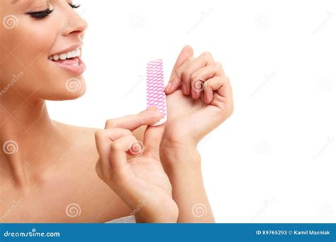 Adult Woman Polishing Fingernails With The Nail File Stock Image