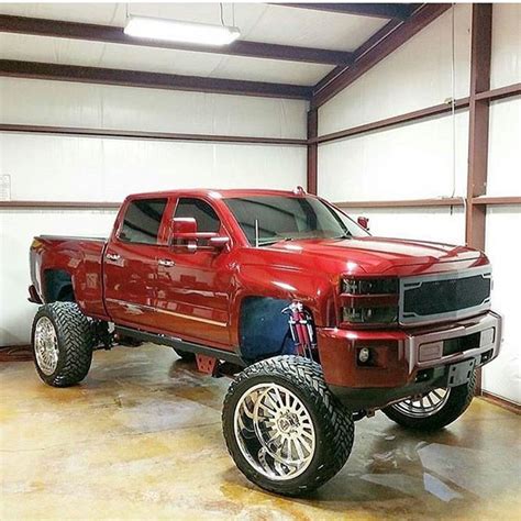 A Large Red Truck Parked In A Garage