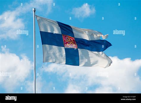 Flag Of Finland Waving In The Wind Blue Sky On The Background Stock