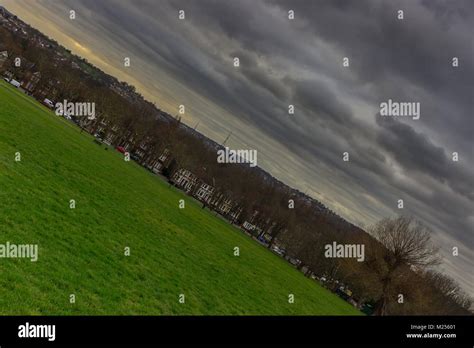 Sun Rays Shining Through The Clouds Hilly Fields Brockley Stock Photo