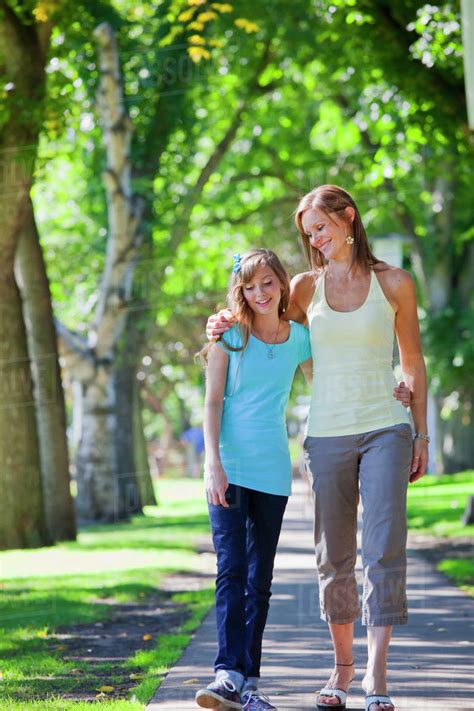 Mother And Daughter Walking Together In The Park Edmonton Alberta