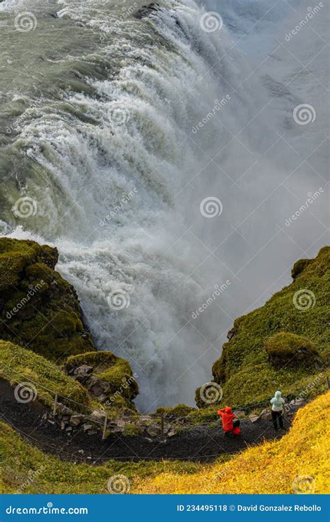 Tourists Visiting Gulfoss Golden Falls Waterfall Iceland Stock Photo