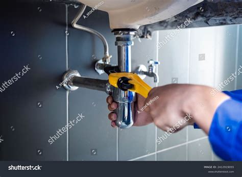 Plumber Fixing White Sink Pipe Adjustable Stock Photo 2412919055