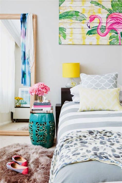 A Bedroom With Pink Flowers And Blue Accents