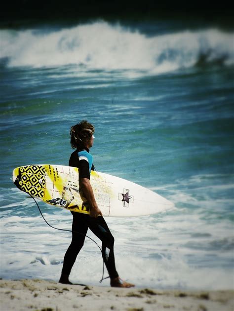 Surfer on Scarborough Beach, WA, Australia