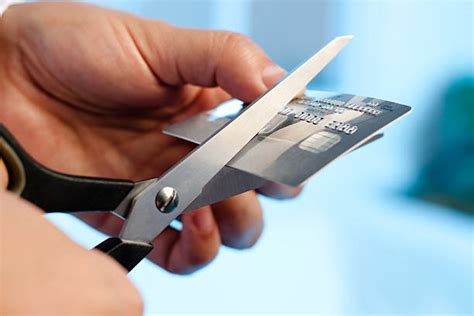 Cutting Up Credit Card Stock Photos Pictures And Royalty Free Images