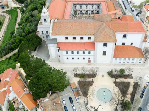 Aerial view drone shot from the side of the Cristo rei monument and the ...